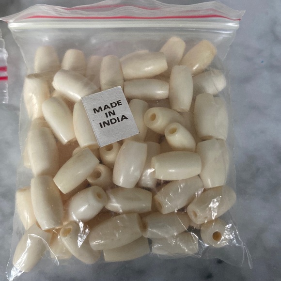 Jewelry - Bead, bone (bleached), white, 13x5mm-13x8mm hand-cut hairpipe pkg 64.